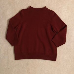 Reddish-brown mock-neck sweater